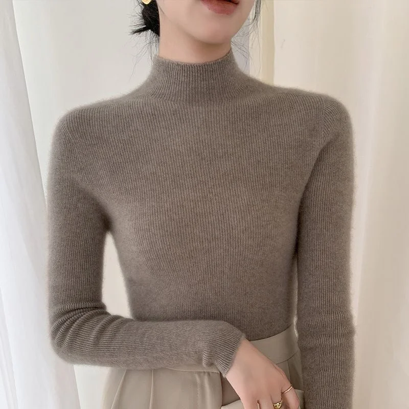 Mock-Neck Wool Sweater — Loose pure wool sweater with a mock neck, shown in black, taupe, camel and deep red